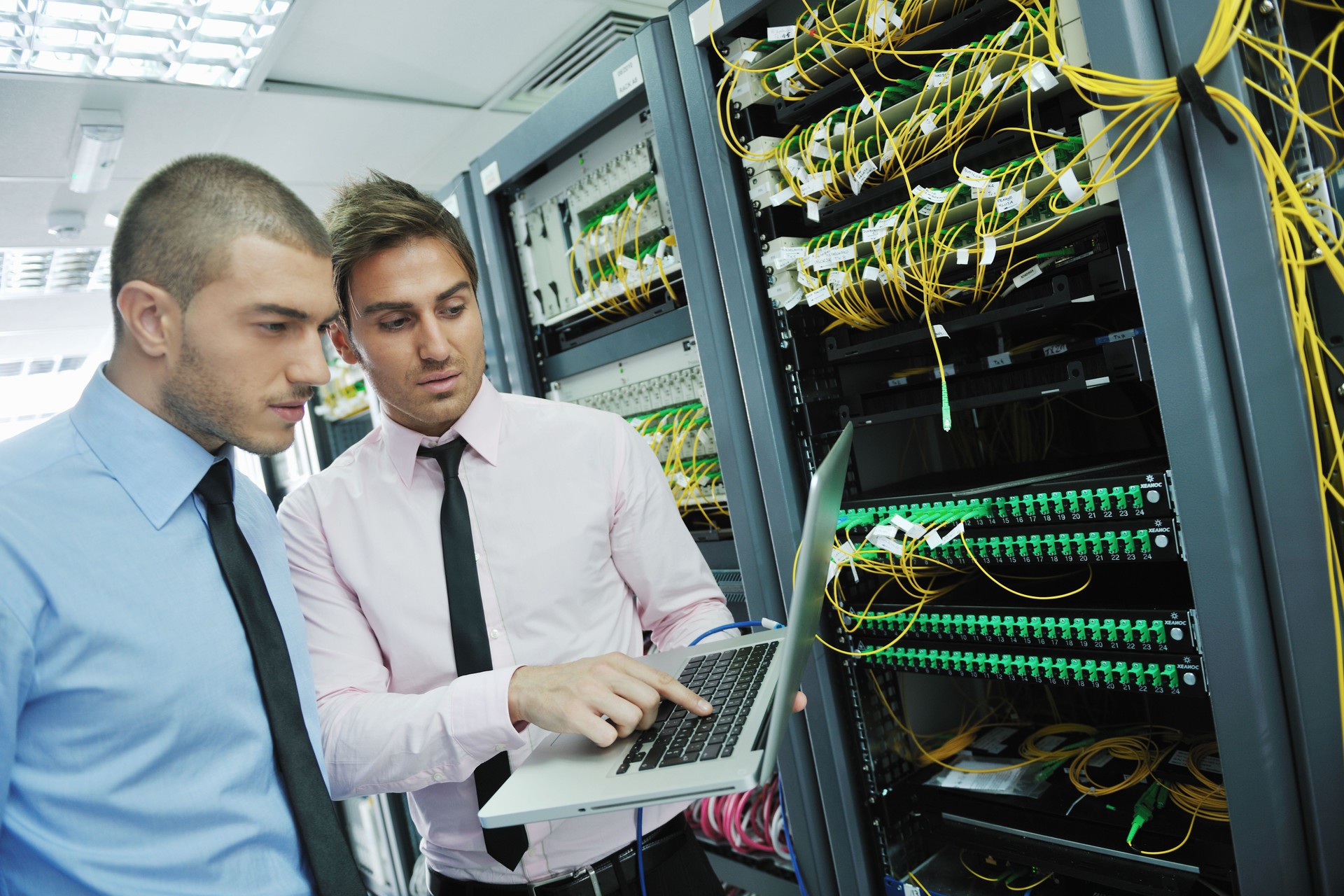 IT engineers solving problems in network server